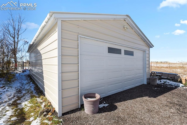 view of snow covered garage