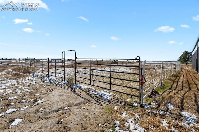 view of yard featuring an outbuilding and a rural view