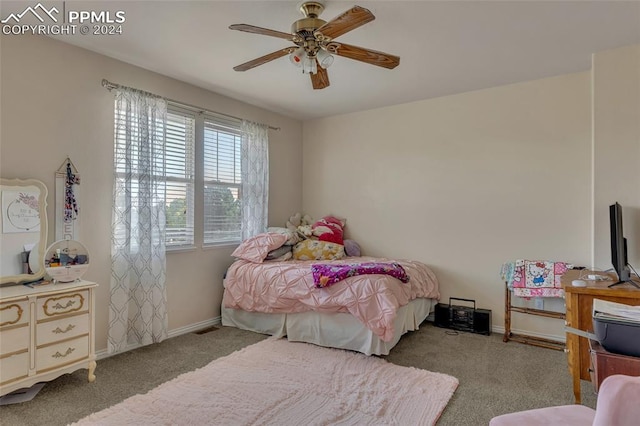 bedroom with ceiling fan and light carpet