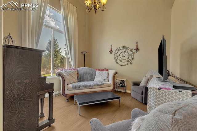 sitting room featuring light hardwood / wood-style flooring and a notable chandelier