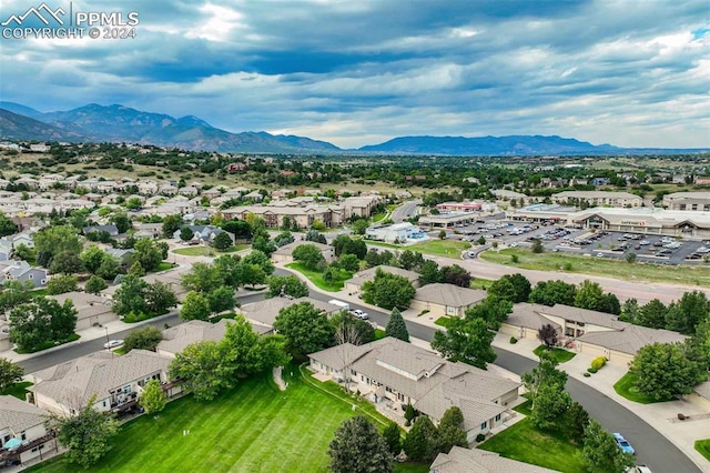 birds eye view of property with a mountain view