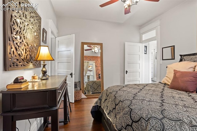 bedroom featuring ceiling fan, vaulted ceiling, and dark wood-type flooring