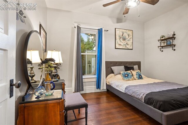 bedroom featuring dark hardwood / wood-style floors and ceiling fan