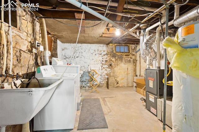 basement featuring sink and washing machine and dryer