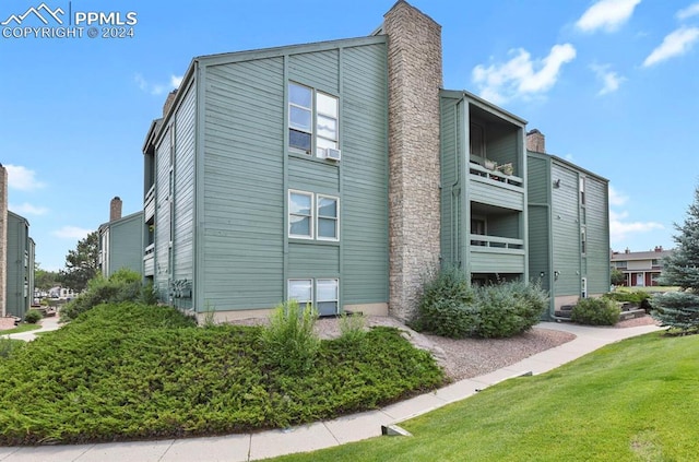 140 W Rockrimmon Blvd Unit 201, Colorado Springs, CO 80919 - view of side of property with a yard