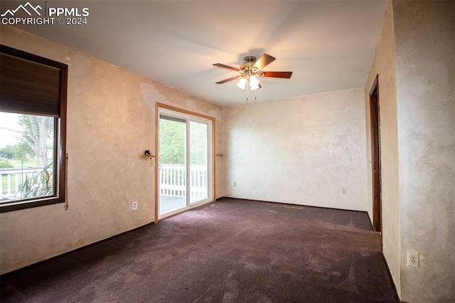 spare room with ceiling fan and carpet floors