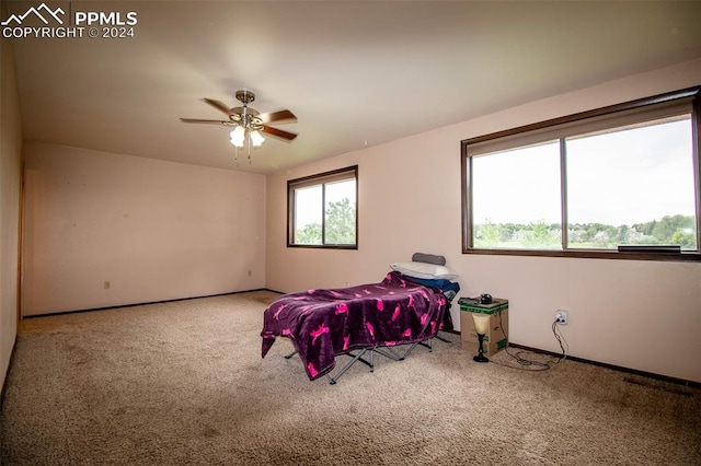 bedroom featuring ceiling fan and carpet floors