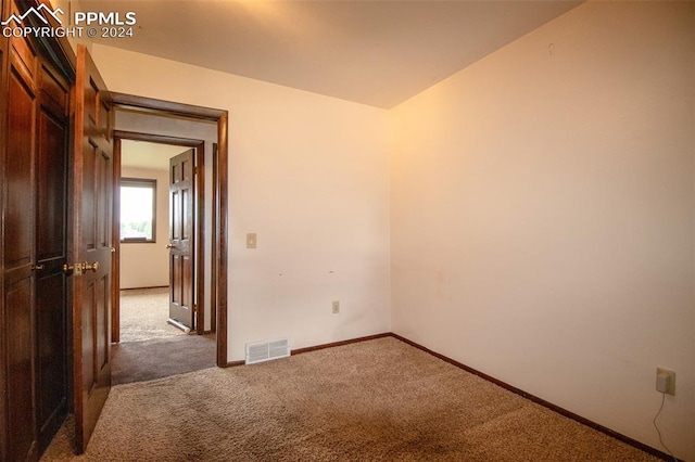 empty room featuring carpet floors