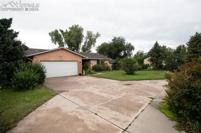 exterior space featuring a front lawn and a garage