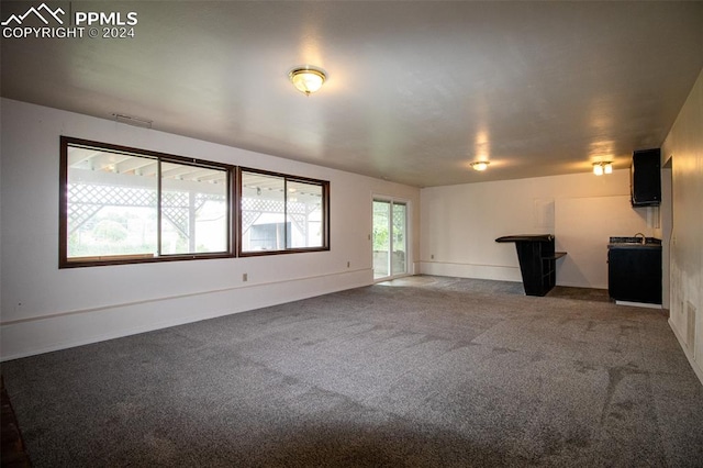 unfurnished living room with carpet