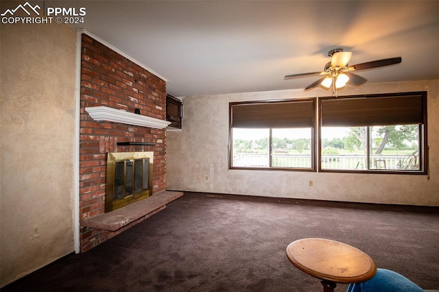 unfurnished living room featuring a fireplace, a healthy amount of sunlight, carpet, and brick wall