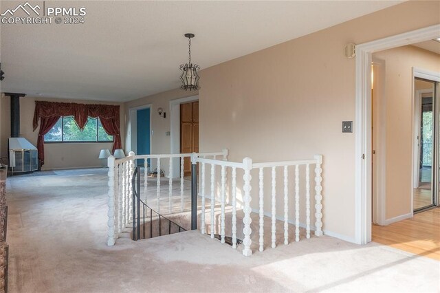 hall with hardwood / wood-style flooring