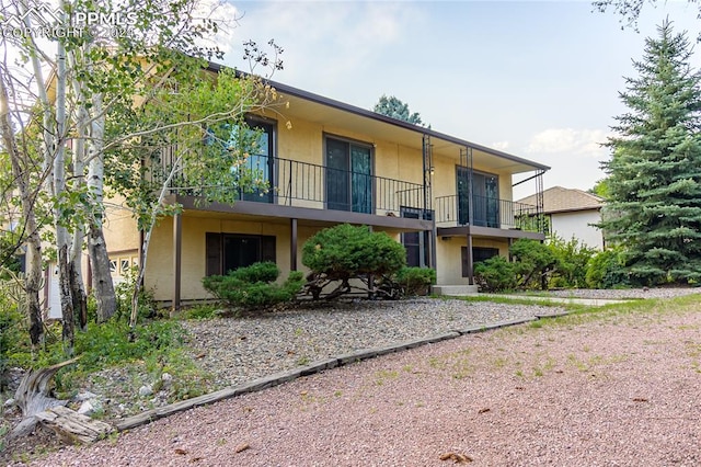 view of front of house with a balcony