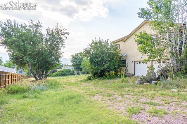 view of yard with a garage