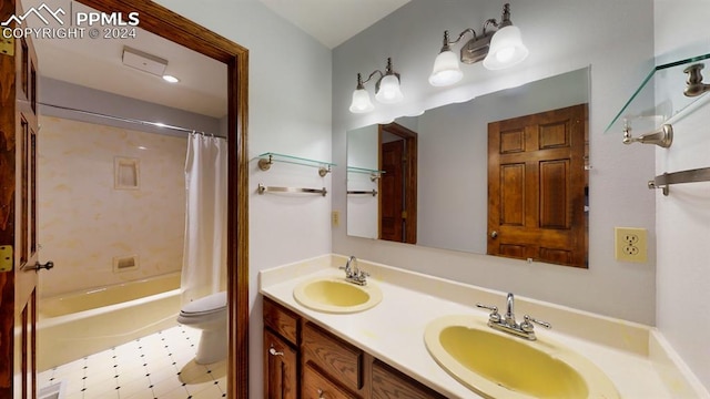 full bathroom featuring double sink vanity, toilet, shower / bath combination with curtain, and tile patterned flooring