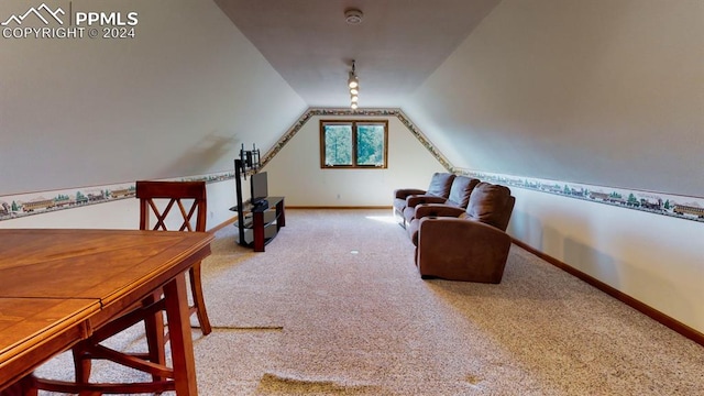 interior space featuring vaulted ceiling and carpet floors