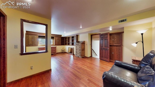 unfurnished living room featuring wood-type flooring