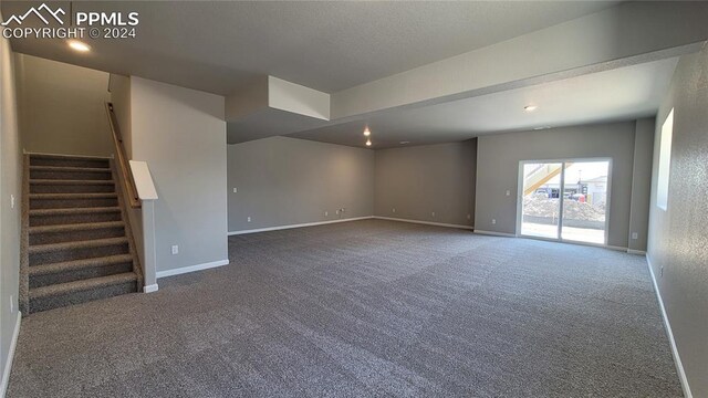 interior space featuring dark carpet