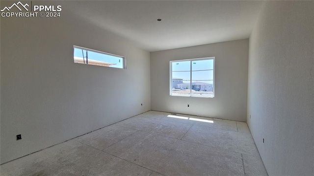 spare room featuring plenty of natural light