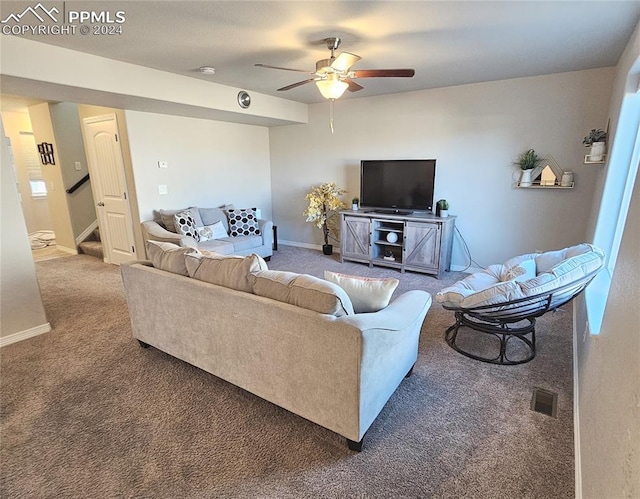 living room with ceiling fan and carpet flooring