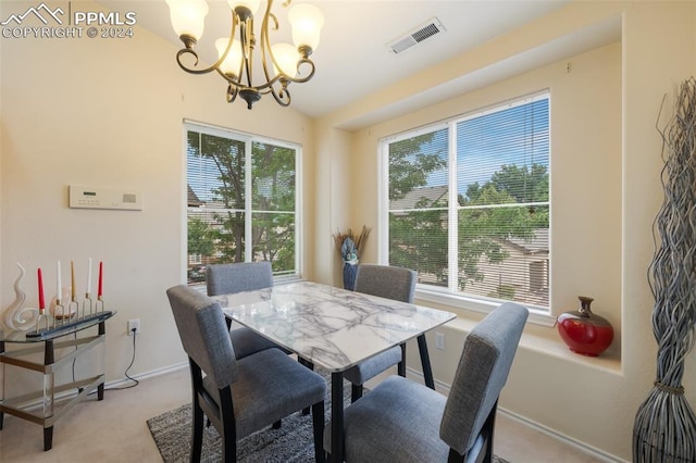 carpeted dining area with an inviting chandelier and a wealth of natural light