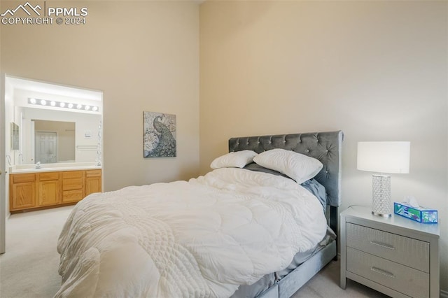 carpeted bedroom with connected bathroom