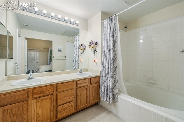 bathroom featuring vanity and shower / bath combo with shower curtain