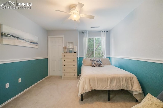 carpeted bedroom featuring ceiling fan