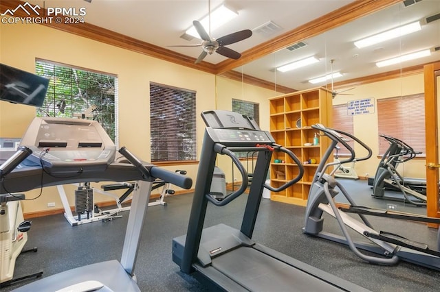 gym featuring ceiling fan and ornamental molding