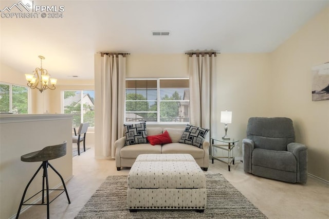 sitting room featuring a chandelier