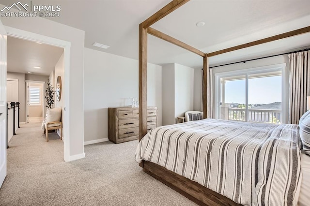 carpeted bedroom featuring access to exterior