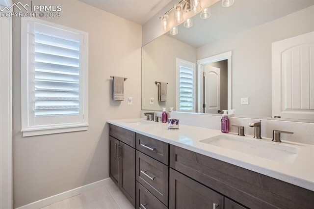 bathroom featuring tile patterned floors and vanity