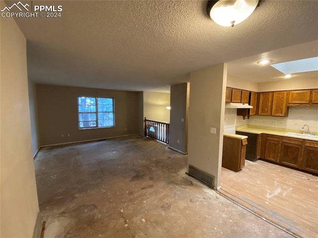 kitchen with sink and a textured ceiling