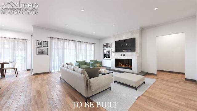 living room with crown molding and light hardwood / wood-style flooring