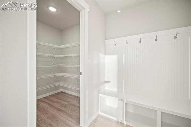 mudroom with light hardwood / wood-style flooring