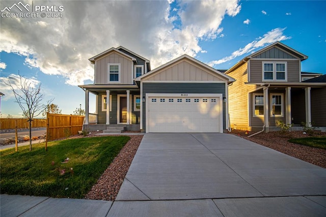 view of front of home featuring a garage and a front yard