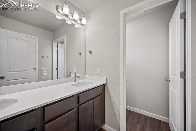 bathroom featuring vanity and hardwood / wood-style flooring