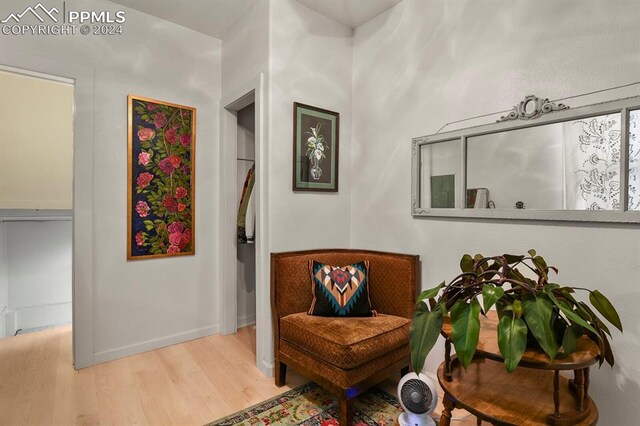 sitting room with light hardwood / wood-style floors