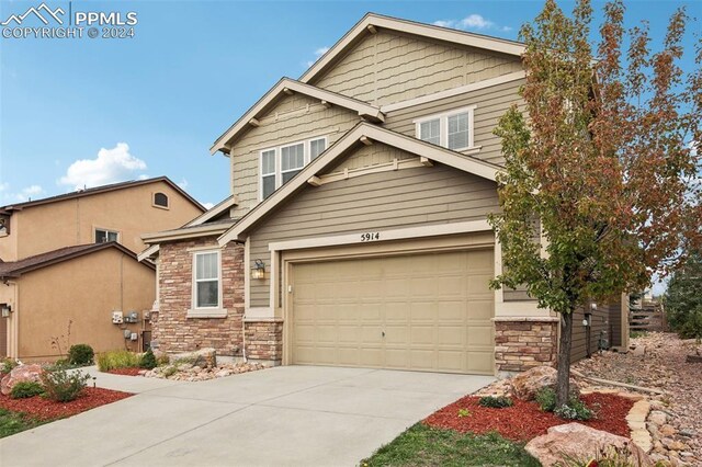 craftsman house with a garage