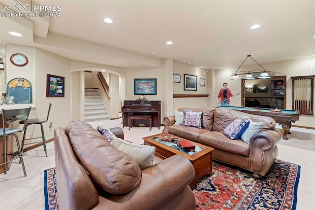 carpeted living room with pool table