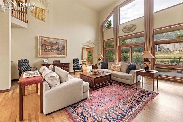 living room with plenty of natural light and light wood-type flooring