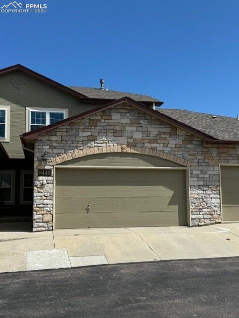 exterior space with a garage