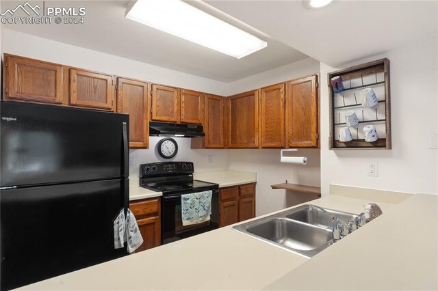 kitchen featuring sink and black appliances