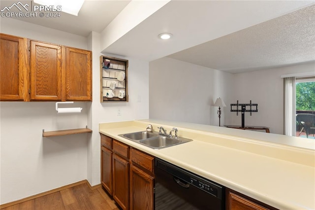 kitchen with sink, dark hardwood / wood-style floors, and dishwasher