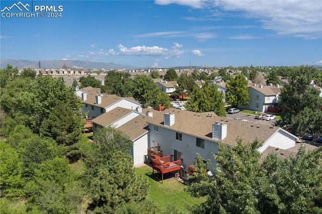 birds eye view of property with a mountain view