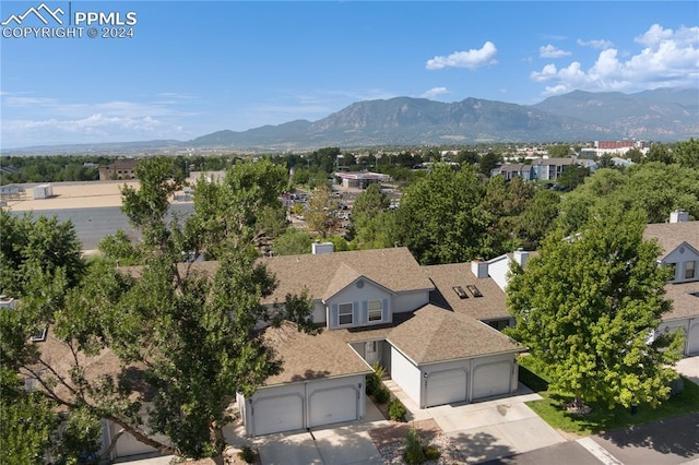 birds eye view of property with a mountain view