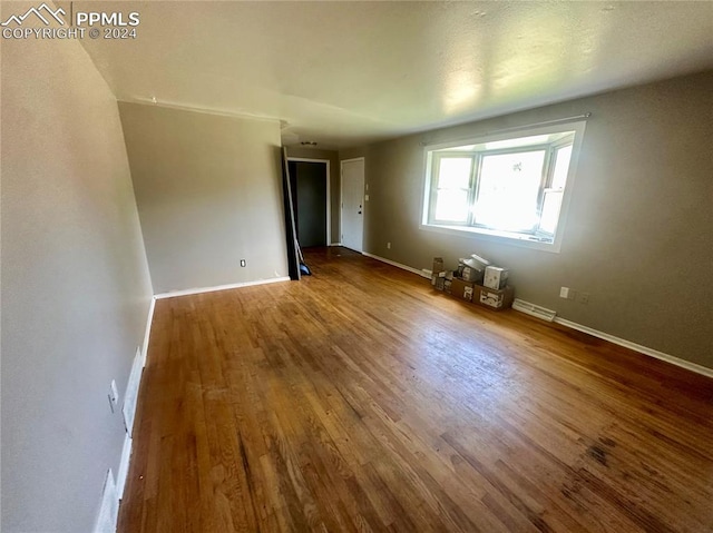 empty room featuring hardwood / wood-style floors