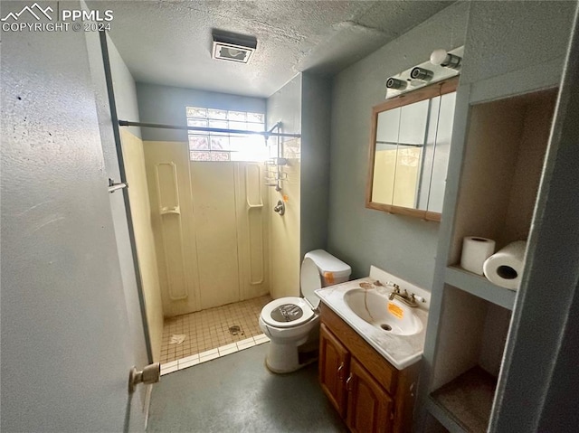 bathroom featuring walk in shower, toilet, a textured ceiling, and vanity