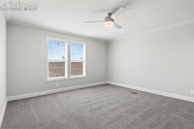 empty room with carpet, ceiling fan, and crown molding