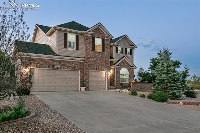 view of front of property with a garage